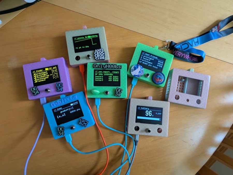 the four case colours side by side: green, blue, pink and multicolour